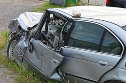 silver car that is totaled after a crash