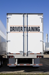 Semi with "driving training" sign on back doors