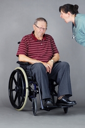 nursing home staff yelling at an elderly man in wheelchair