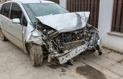 front-end of a silver car destroyed after an accident in Georgia