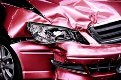 red sedan with damage after a car accident
