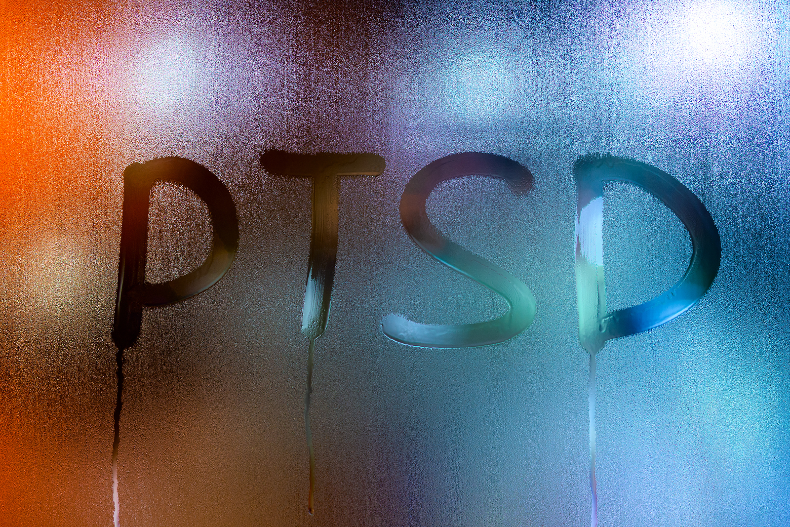 PTSD written in steam on a window