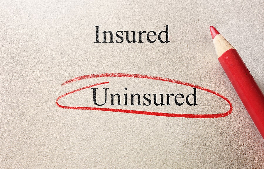 Insured and uninsured written, "uninsured" is circled in red pencil