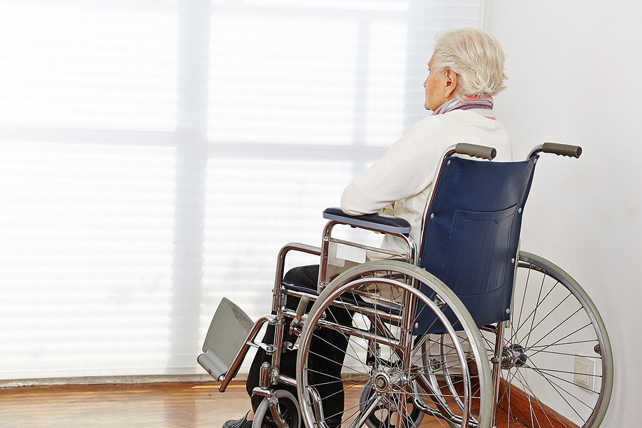Elderly person in a nursing home wheelchair