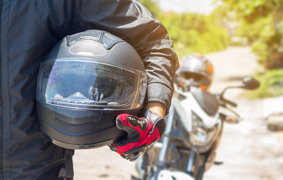 Atlanta motorcycle rider holding helmet on their hip