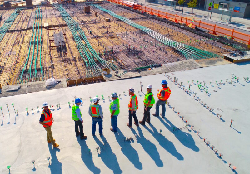 construction workers and engineers on top of building in atlanta