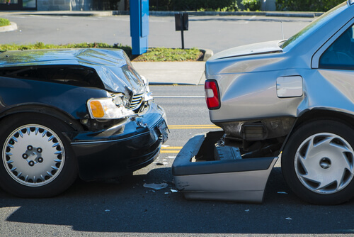 black sedan rear ends a silver sedan causing damage and injuries in Gwinnett County