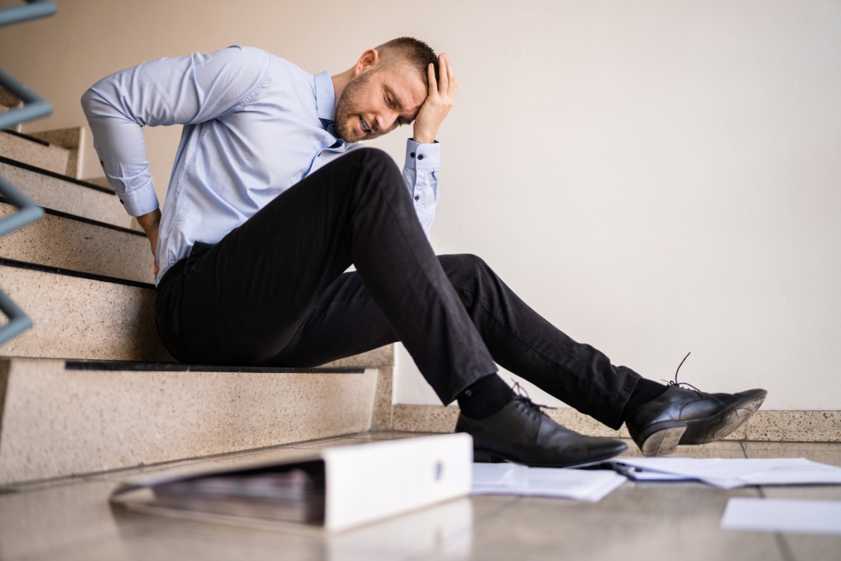 Man on the stairs after a workplace accident