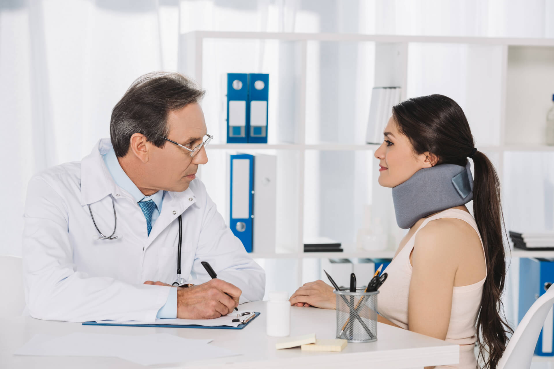 doctor sitting and talking with female patient