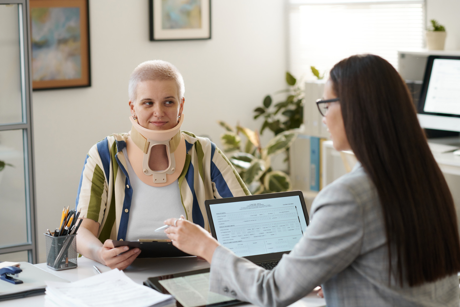 injured woman with lawyer