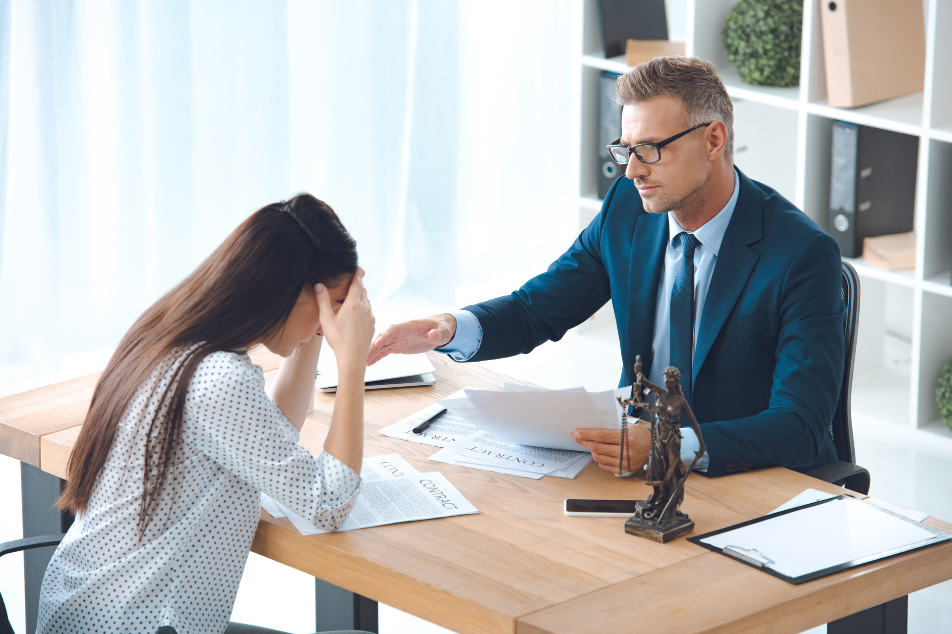 lawyer working with upset female client