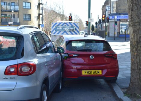 Two cars involved in a minor collision on a city street