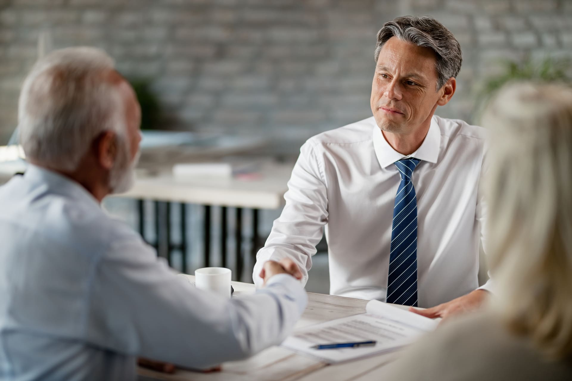 Lawyer shaking hands with client