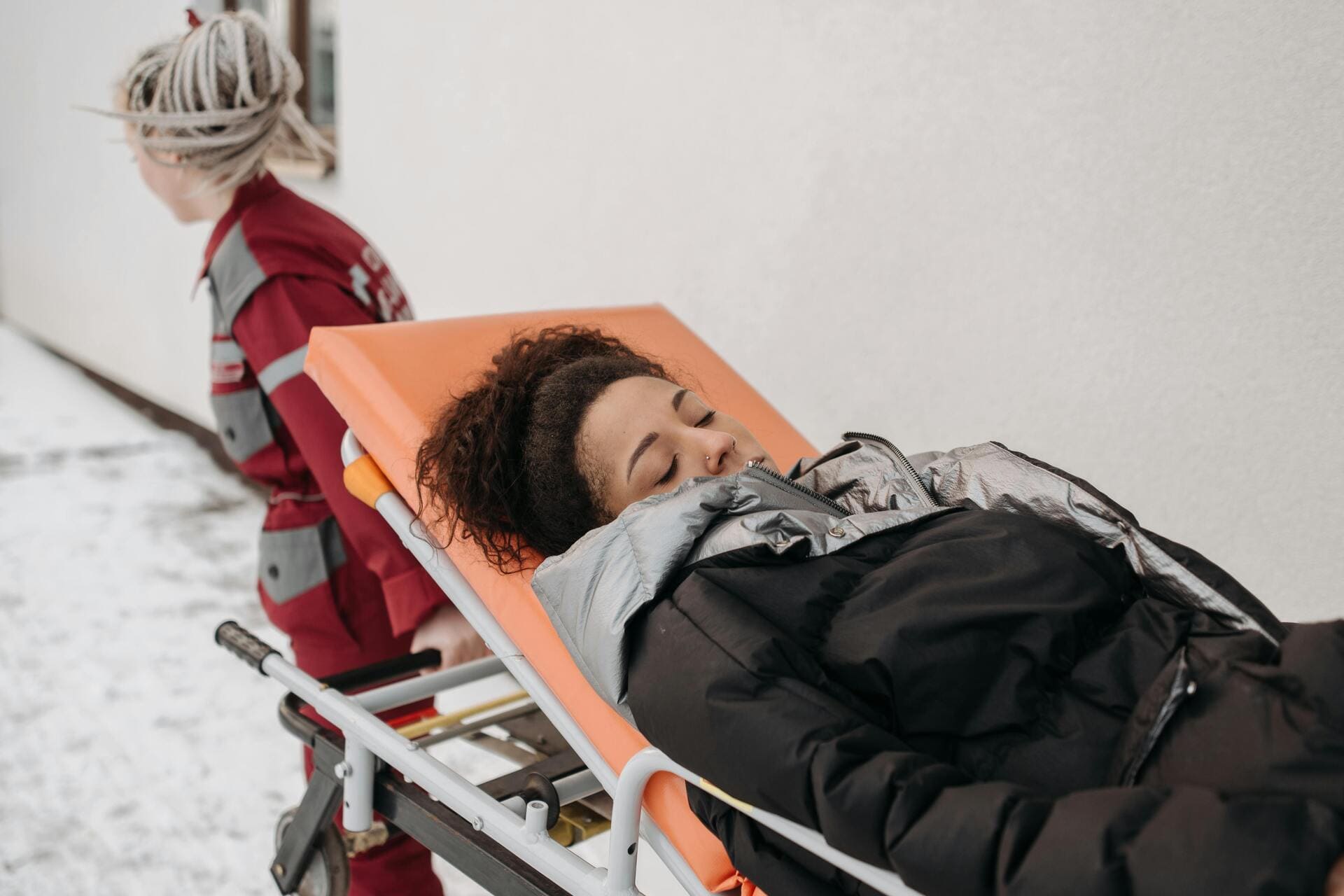 injured woman in hospital bed
